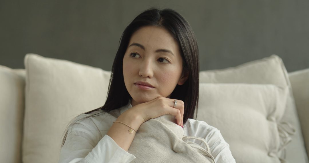 Everyday Japandi Lifestyle - A Woman Hugging a Pillow and Thinking With a Soft Smile on Her Face 046 Woman Hugging a Pillow and Thinking With a Soft Smile on Her Face